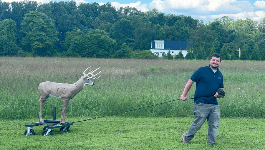 Caleb pulling the deer
